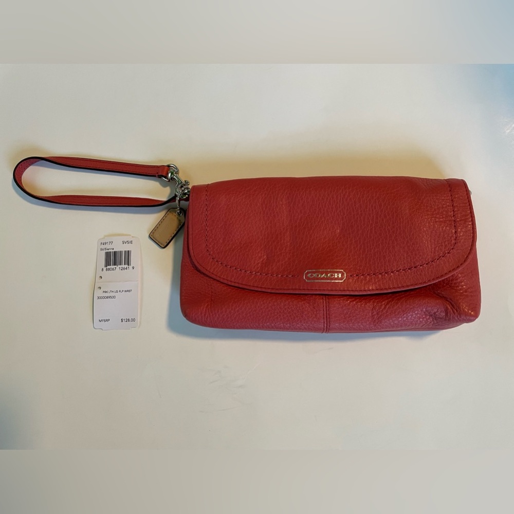 Coach wristlet, coral/salmon color leather, new w/tags, $60.